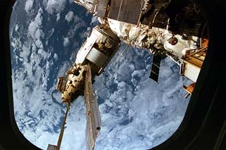 View of the Mir space station Spektr module as seen from the STS-79 shuttle Atlantis. The module is framed by the aft flight deck window frame. 